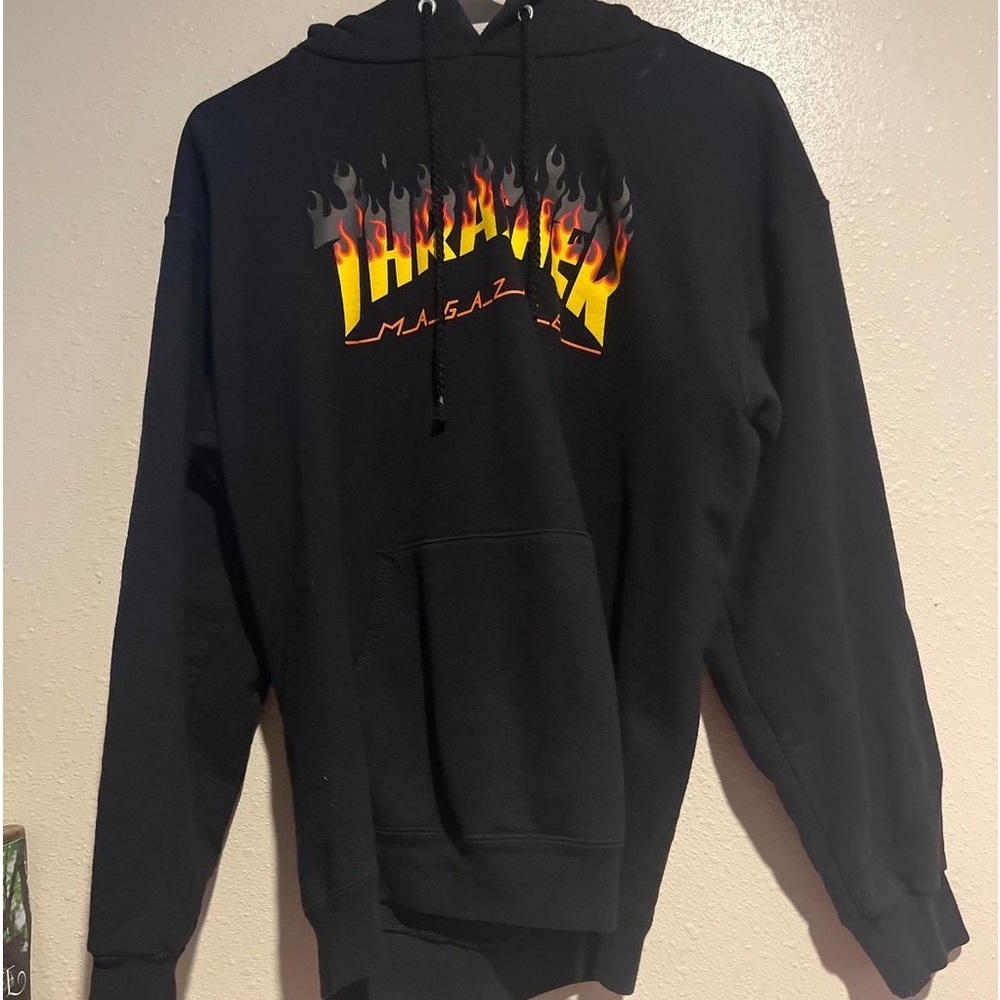 Thrasher hoodie good condition a hold on the back of the hoodie but can’t see it